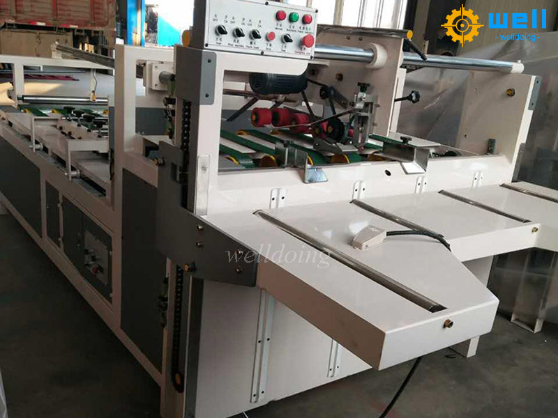 What is the difference between semi-automatic box nailing machine and box gluing machine?